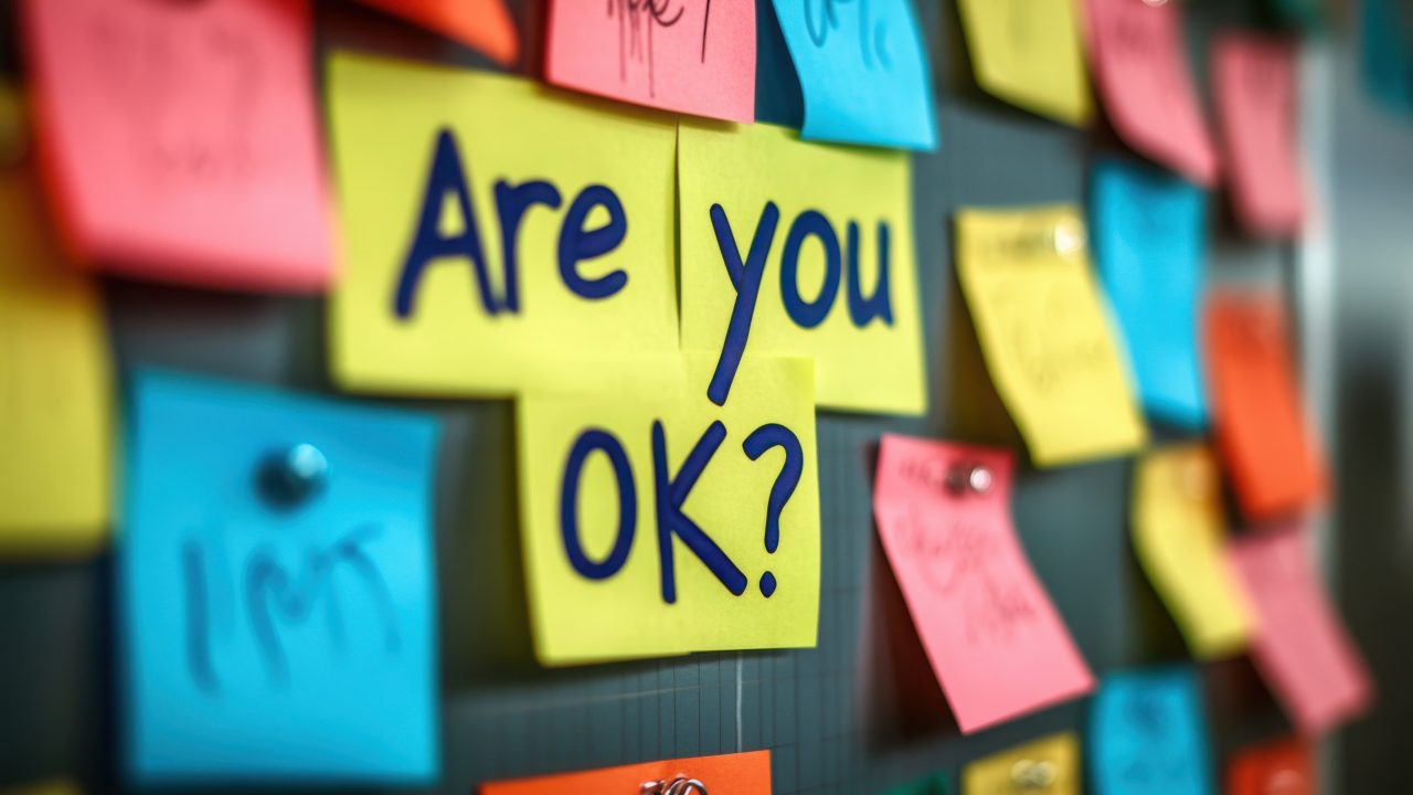 colourful board with sticky notes with 'Are you OK?' written out in the centre